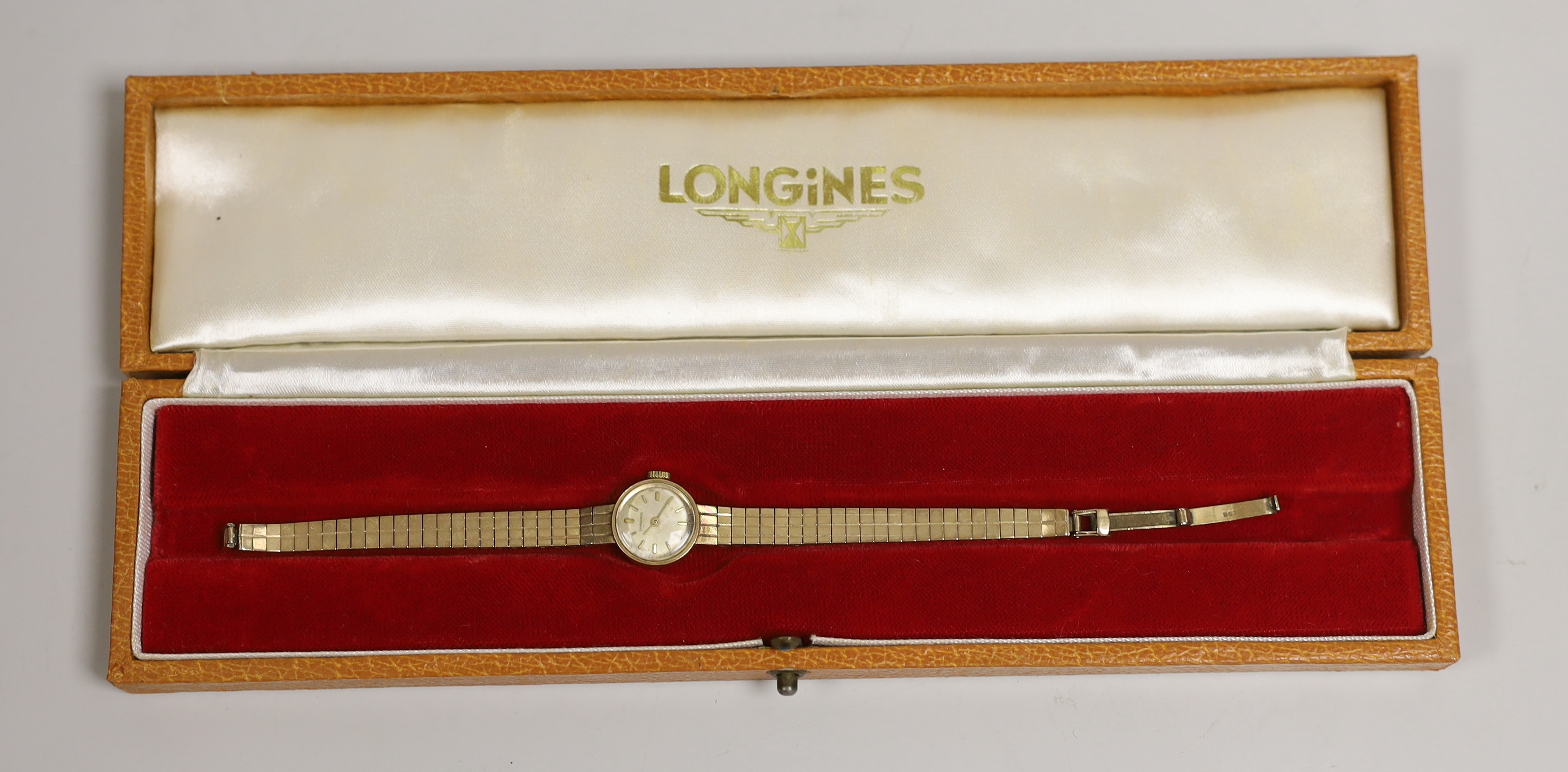 A lady's 9ct gold Longines manual wind wrist watch, 15cm, gross weight 16.5 grams, with a Longines box.